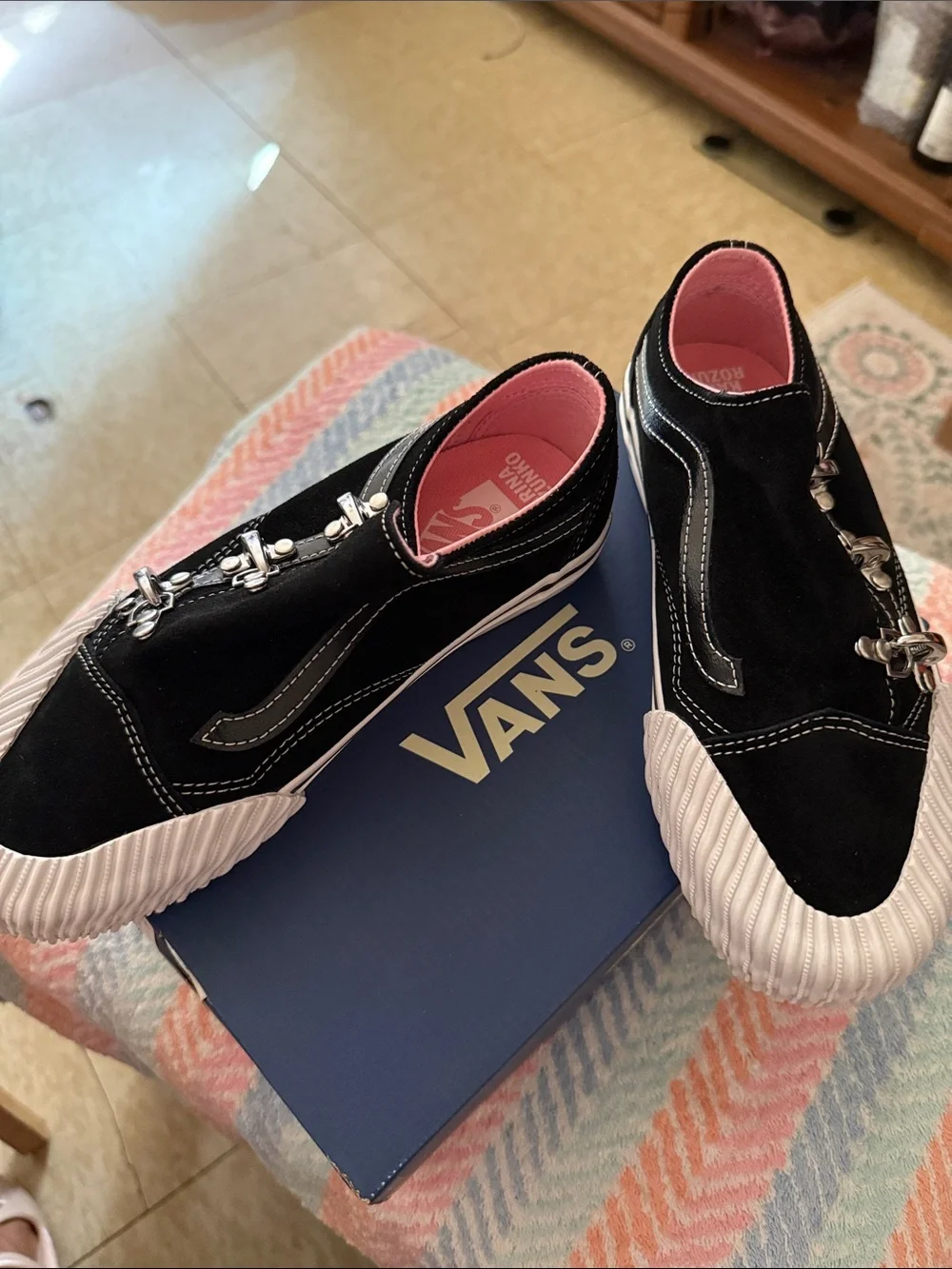 Black Slip-On Sneakers with Pink Lining and Silver Hardware Vans